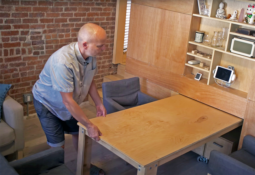 Fluid NYC flat uses sliding furniture to create 3 rooms in 1